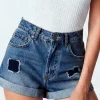 Short Calvin Klein con Parches - Talla S (27/4)